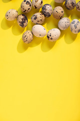 Happy Easter! Flat lay.  Vertical Yellow easter background with eggs. Text spase