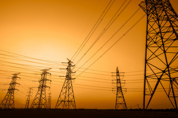 High voltage power tower and beautiful nature landscape at sunset