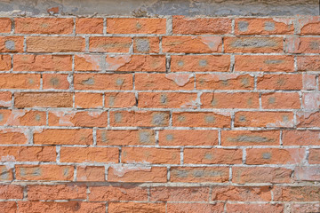 Crashing red brick wall texture, background of old cracked brickwork