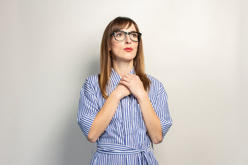 beautiful young girl look sideways on a light background. Concept of summer, vacation, travel. Banner