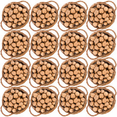 Walnut in a basket isolated over white background.