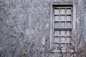 Old trellised wooden window closed by fabric, copy space for text.