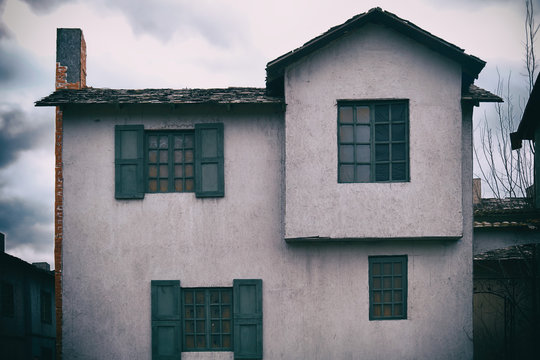 An Old Two Story House With A Chimney In The Style Of Retro American Buildings Of The Wild West