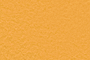 Orange sponge background, abstract fabric texture close-up