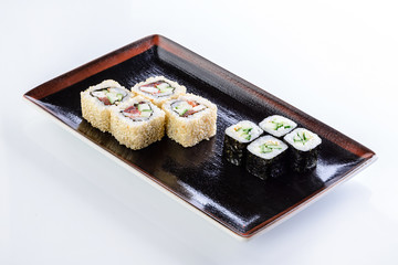 sushi rolls in a plate on a light background set