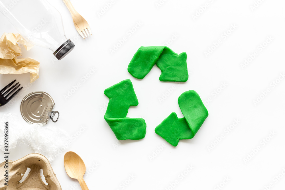 Canvas Prints Recycle concept. Green arrows icon among waste on white background top-down copy space