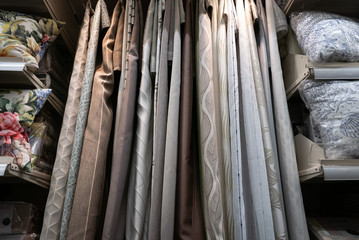 Fabric materials in a shop. Curtains at market.