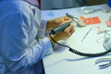 Internship in a clinic with medical students. Woman intern in training trains on the creation of...