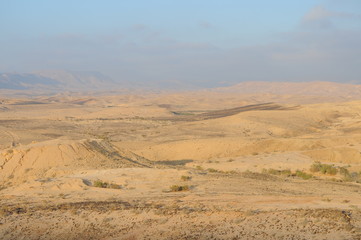 Desert landscape at sunrise. Hiking desert part of Israel National Trail. Negev desert . Valley. Colorful sands 