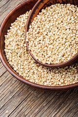 Green buckwheat on wooden table