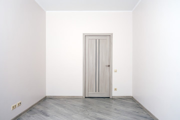 Empty room with the completed renovation, but without furniture