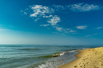 Sea view from tropical beach with sunny sky.