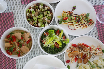 Various healthy fish and vegetables meals served on the table, healthy summer lunch