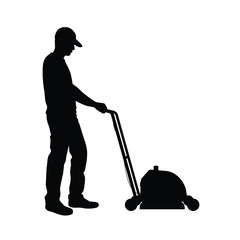 Man and grass mowing equipment silhouette