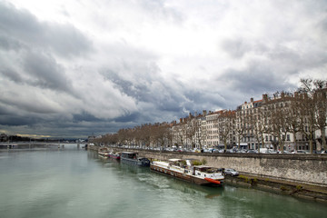 Fototapeta na wymiar Stormy sky over the Banks of the river Rhone in Lyon, France.