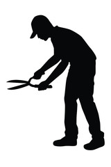 Man and grass mowing equipment silhouette