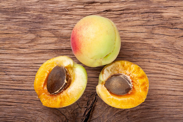 apricots on a dark wooden background. toning. selective focus