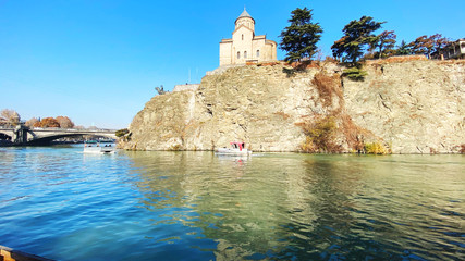 TBILISI, GEORGIA  DECEMBER 14, 2019:  Old Tbilisi architecture,  Kura river in Tbilisi, Georgia © Victoria Key