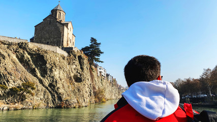 TBILISI, GEORGIA  DECEMBER 14, 2019:  Old Tbilisi architecture, Metekhi church and Kura river in Tbilisi, Georgia © Victoria Key