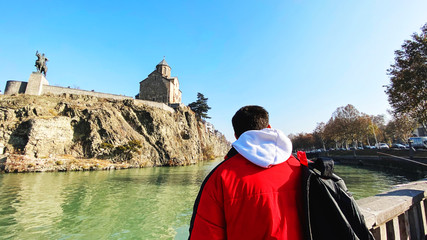 TBILISI, GEORGIA  DECEMBER 14, 2019:  Old Tbilisi architecture, Metekhi church and Kura river in Tbilisi, Georgia © Victoria Key