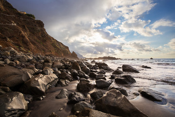 Stony beach of Tenerife with dramatic sky