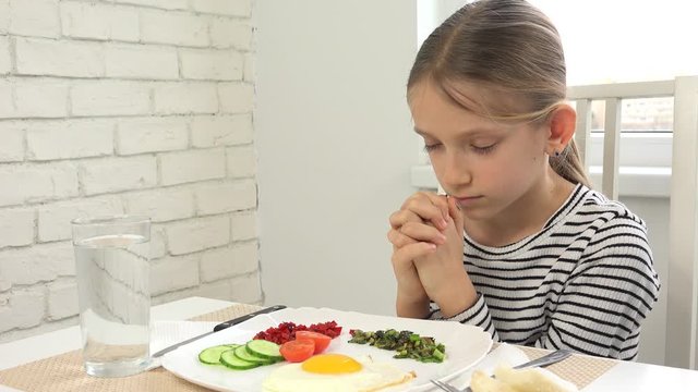 Kid Praying Before Eating Breakfast in Kitchen, Child Preparing Eat Meal, Religious View