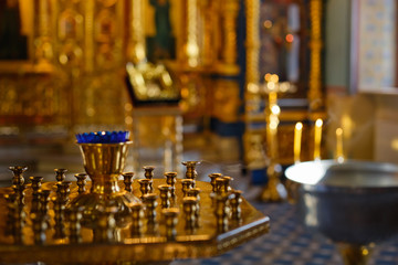 interior of an Orthodox Church with a font for the baptism of children