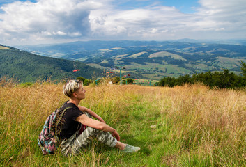 woman traveler resting in the mountains