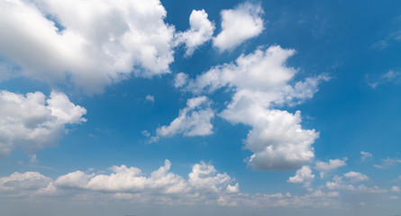 Naklejka na ściany i meble A blue sky with white clouds