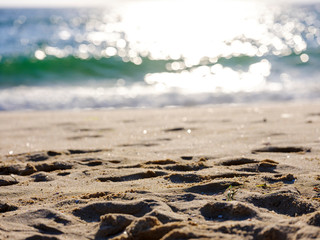 Footprints of feet on the beach at the sea
