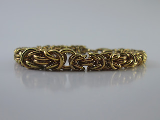 Gold Bracelet. Elegant Jewelry Golden Bracelet Made of Gold Wire.   