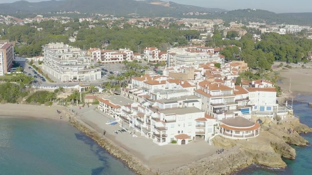 Aerial view of the breakwater that protects a typical Mediterranean town in Roc de Sant Gaieta, Tarragona province, Spain