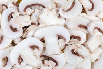 Background of slices of cultivated button mushrooms close-up
