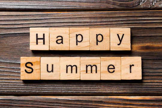 Happy Summer word written on wood block. Happy Summer text on wooden table for your desing, concept