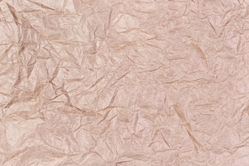 Background of gray brown crumpled wrapping paper, fragment, texture