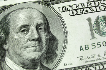 100 Dollars bill and portrait Benjamin Franklin on USA money banknote in closeup.