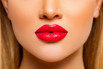 Sexy Red Lips closeup. Beauty Lips with Red Lipstick. Natural Decorative professional Cosmetics. Perfect makeup. Young Woman close up. Profile. Face close-up focus on Lips.      