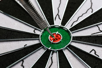 Dartboard with hit bullseye, closeup
