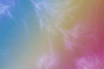 Fluffy white clouds, beautifully blurred on pastel colors.