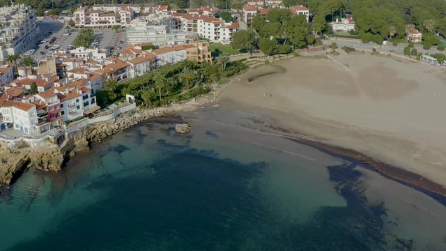Aerial view in winter of the entire beach at Roc de Sant Gaieta, Tarragona province in Catalonia, Spain