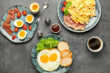 Different tasty dishes with eggs and coffee on table