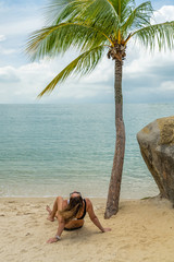 Fototapeta na wymiar Woman at the beach in Sentosa island