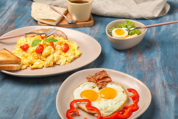 Different tasty dishes with eggs on table