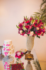 wedding cake, sweets and flower arrangement