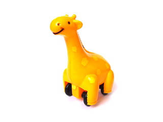 Close up of orange color giraffe toy isolated on white background. Kids toy. Plastic toy.