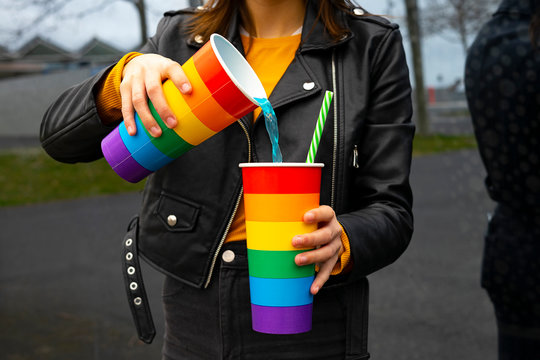 Woman Pouring Soda Into A Glass At A Party.