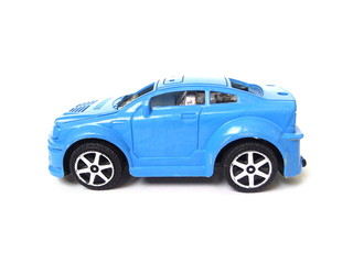 Close up of old blue car toy isolated on white background. Kids toy. Plastic toy.