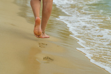 Woman walking on the beach