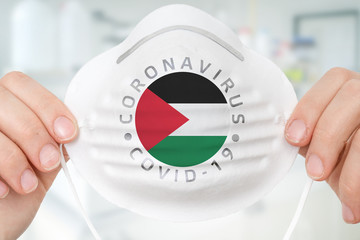 Respirator mask with flag of Palestine - Coronavirus COVID-19 concept