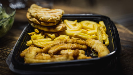 fast food fried potatos and fried squid